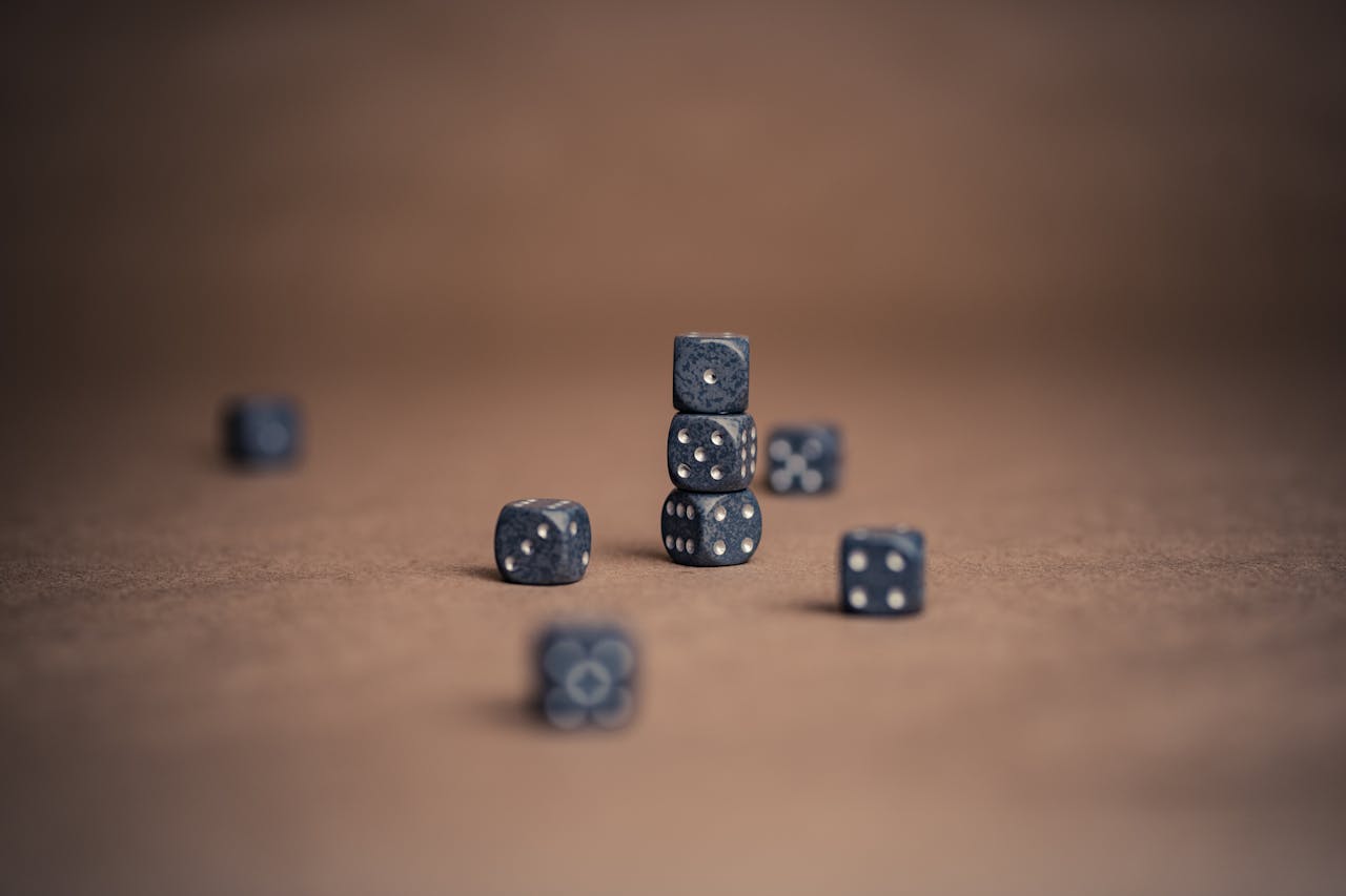 services-03 Artistic display of stacked dice showcasing luck and chance in a minimalist composition.